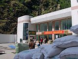 08 China Customs And Immigration Building After Crossing Friendship Bridge From Kodari Nepal After crossing the Friendship Bridge, we meet our Tibetan guide who leads us through China Customs and Immigration.